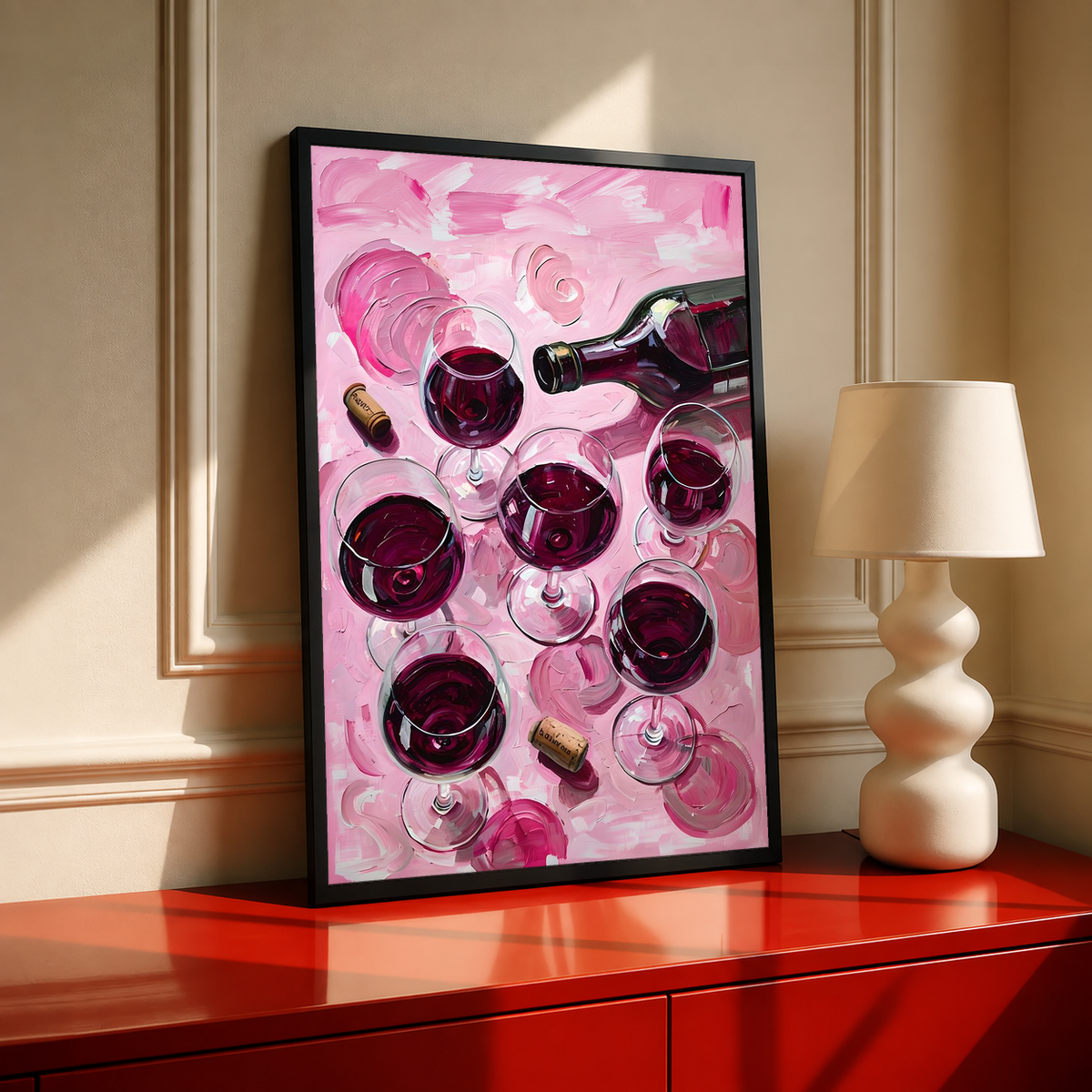 Black-framed wine glass and bottle art print on pink background