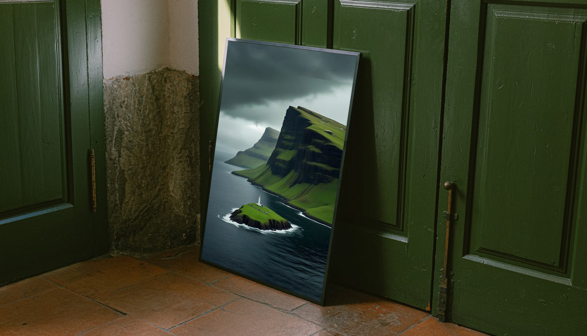 Gold-framed lighthouse cliff landscape print with green islet, dark sea, stormy clouds