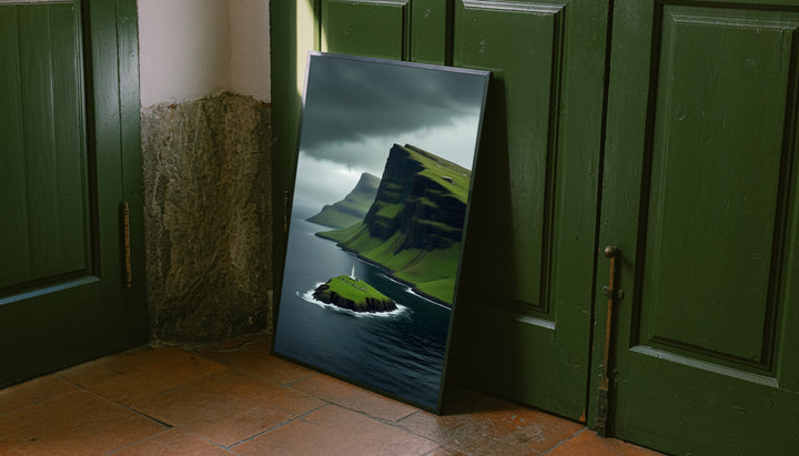 Gold-framed lighthouse cliff landscape print with green islet, dark sea, stormy clouds