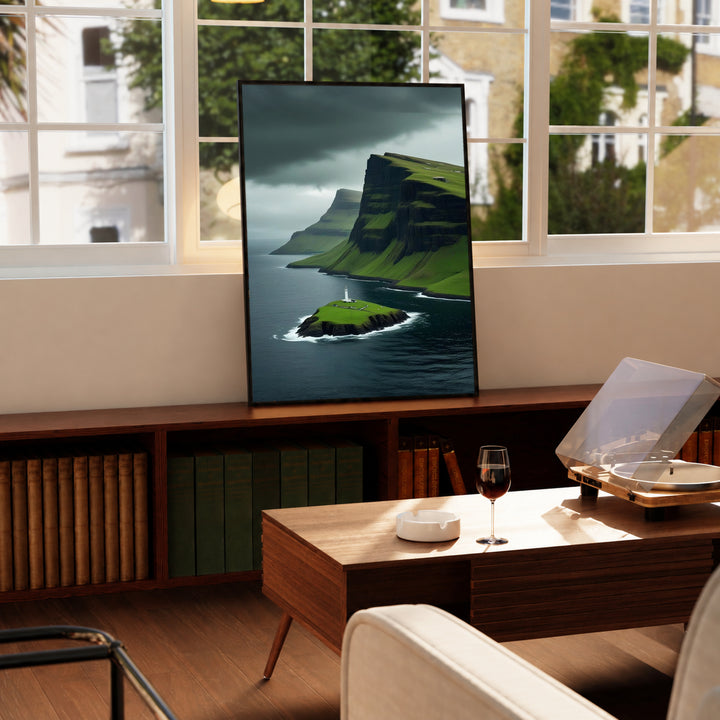 Lighthouse cliff landscape print with green islet and dark sea, propped near windows