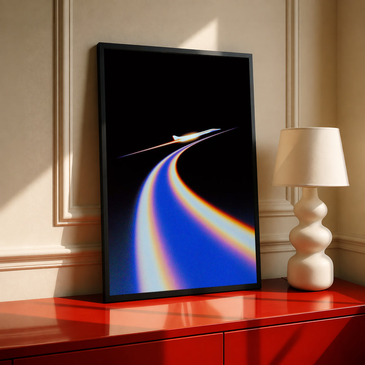 Jet poster with blue and orange flight trail on black, in black frame