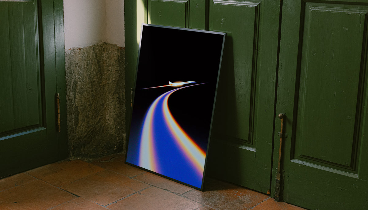 Jet poster with blue and orange flight trail on black, black frame