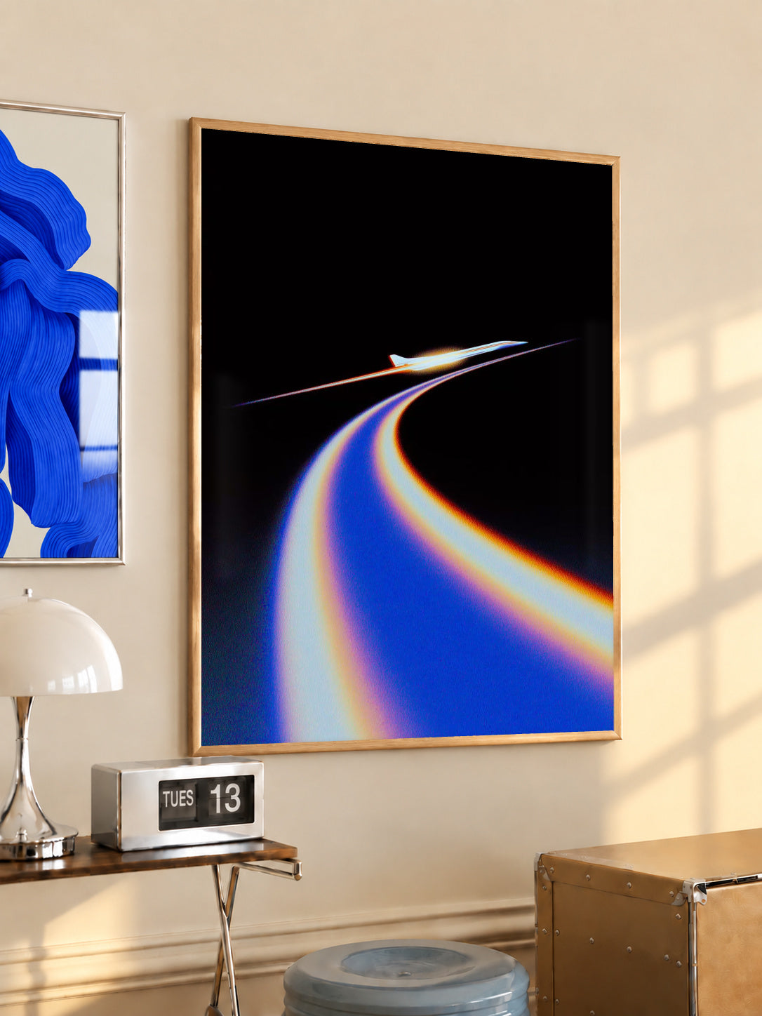 Jet poster with blue and orange light trail on black, in wooden frame