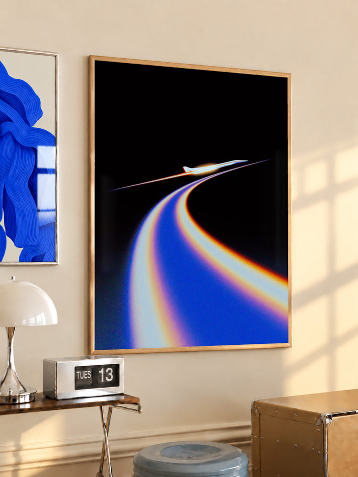 Jet poster with blue and orange light trail on black, in wooden frame