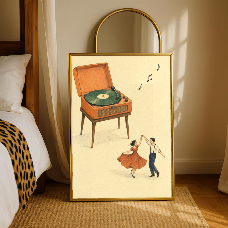 Gold-framed print showing retro record player, dancing couple, and music notes on cream