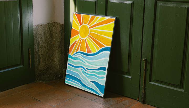Sun rays over ocean waves as an unframed display leaning against a green paneled door on a wood floor