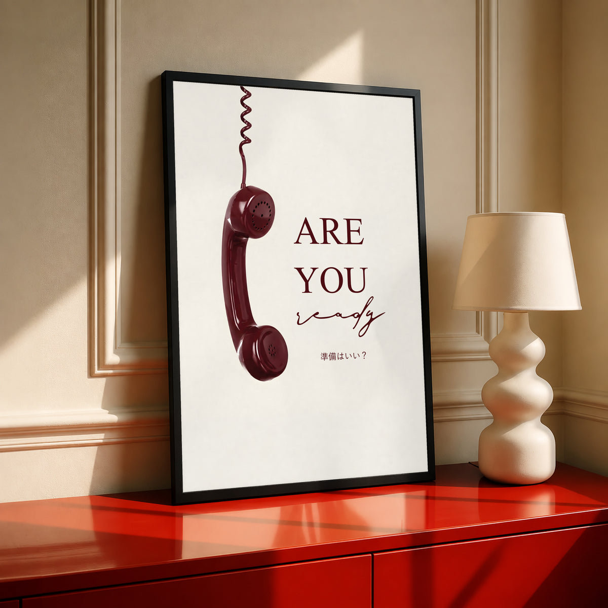 Black-framed telephone typography poster with burgundy 'ARE YOU' on cream