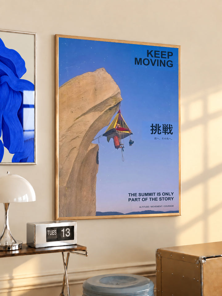 Framed motivational poster with blue sky cliff scene and rock climber, "Keep Moving"