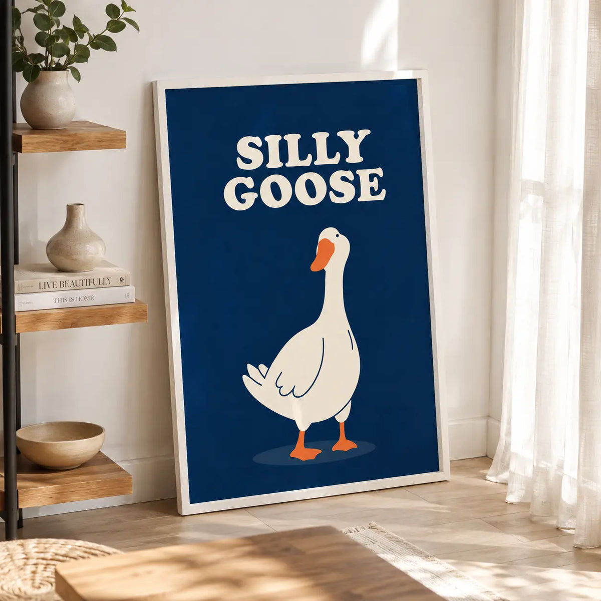 Framed wall art poster with cartoon goose and "SILLY GOOSE" text on blue background