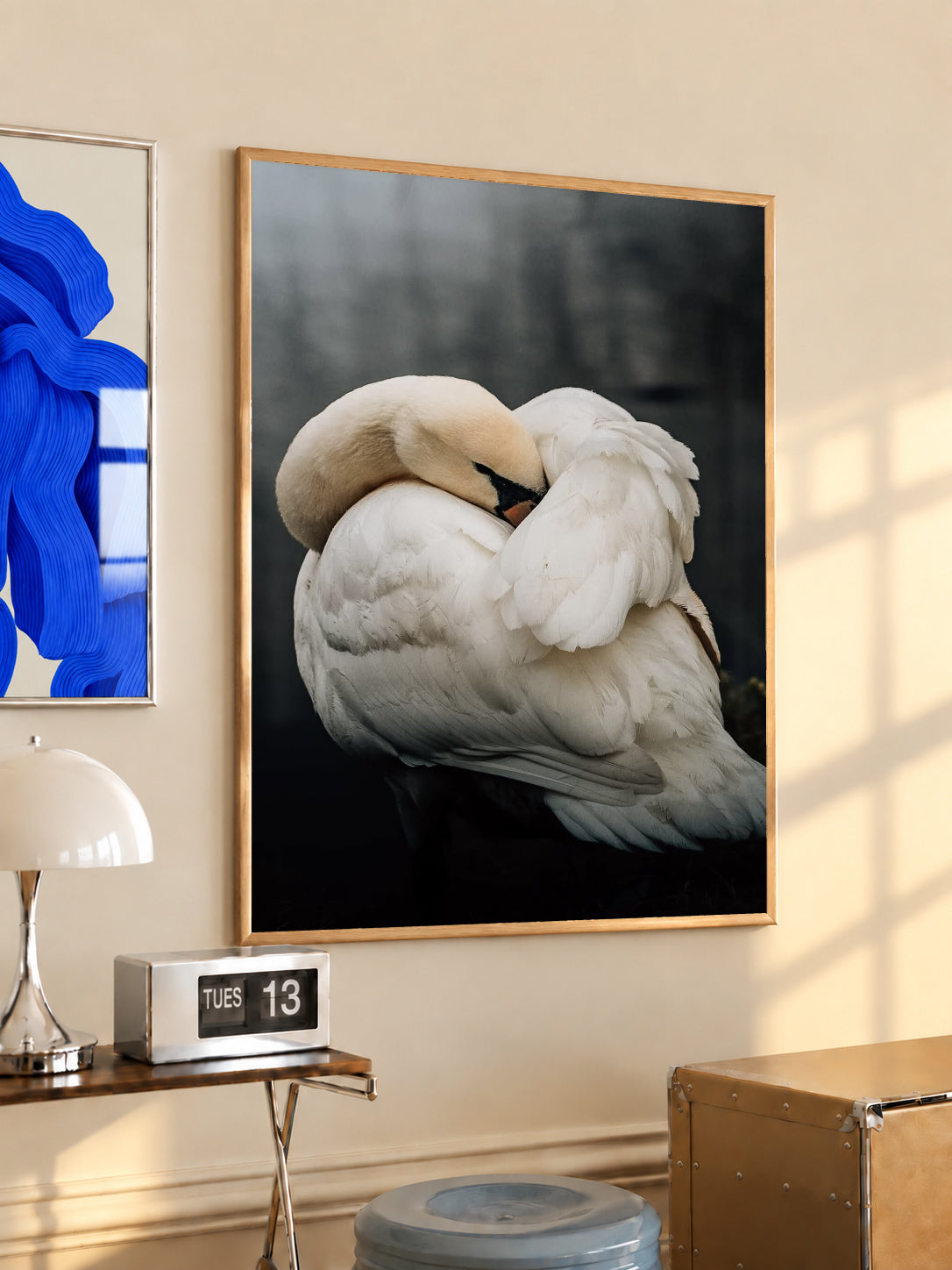 Framed sleeping swans photo print with light wood frame and black inner border
