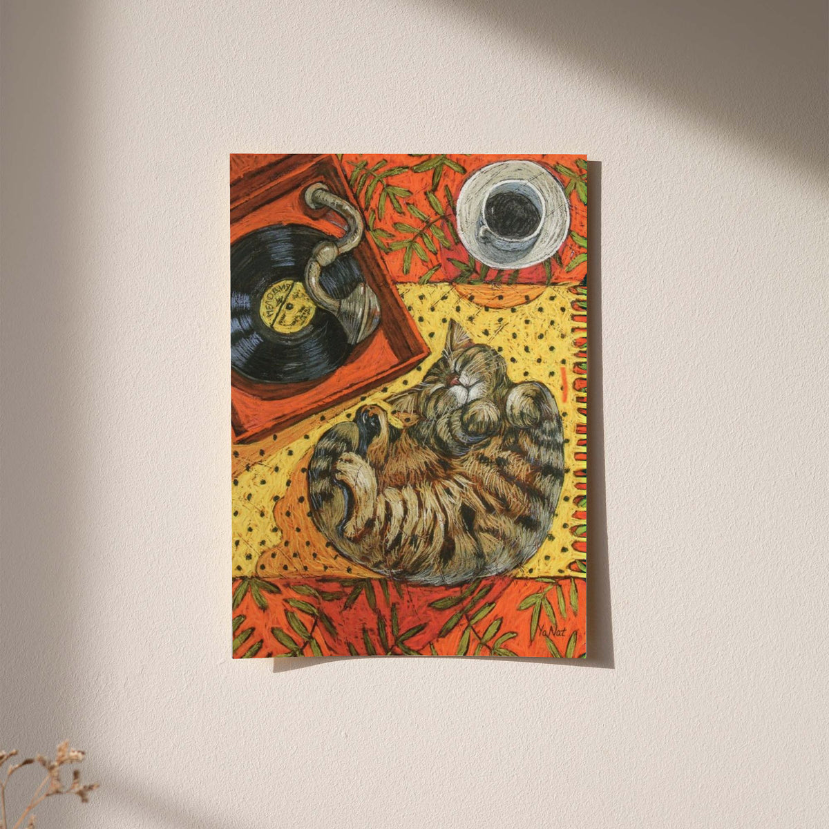 Cat sleeping on vinyl art print on white wall, warm orange collage with light border