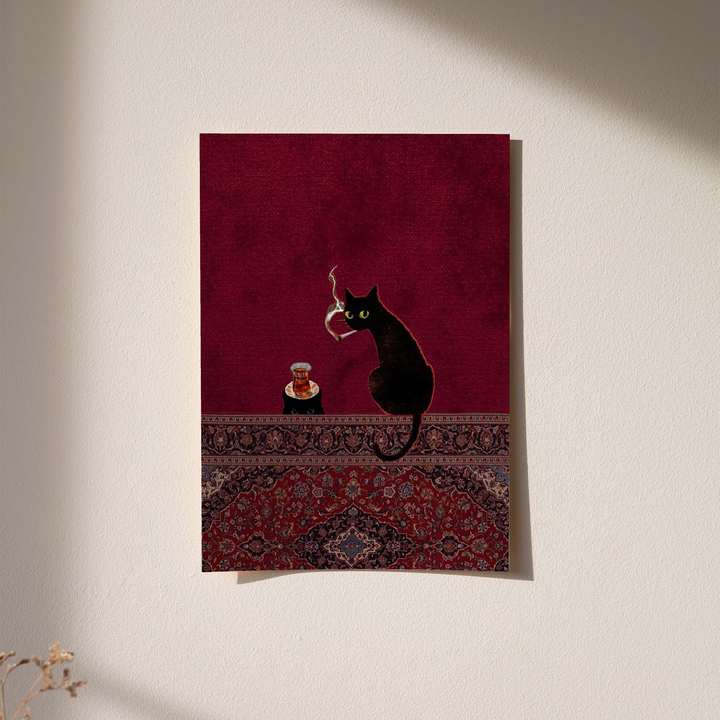 Black cats, tea glass and smoking motif as an unframed print against a pale plaster wall with soft shadows