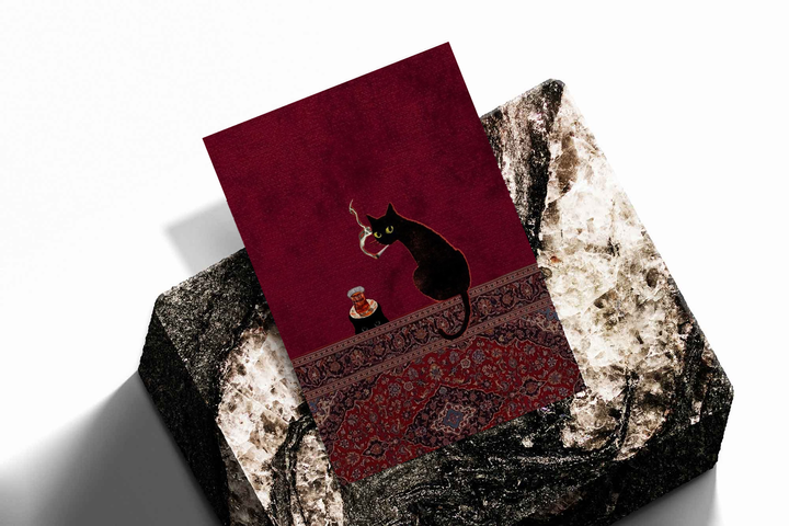 Black cats, tea glass and smoking motif as an unframed print propped against a pale wall on a rough stone