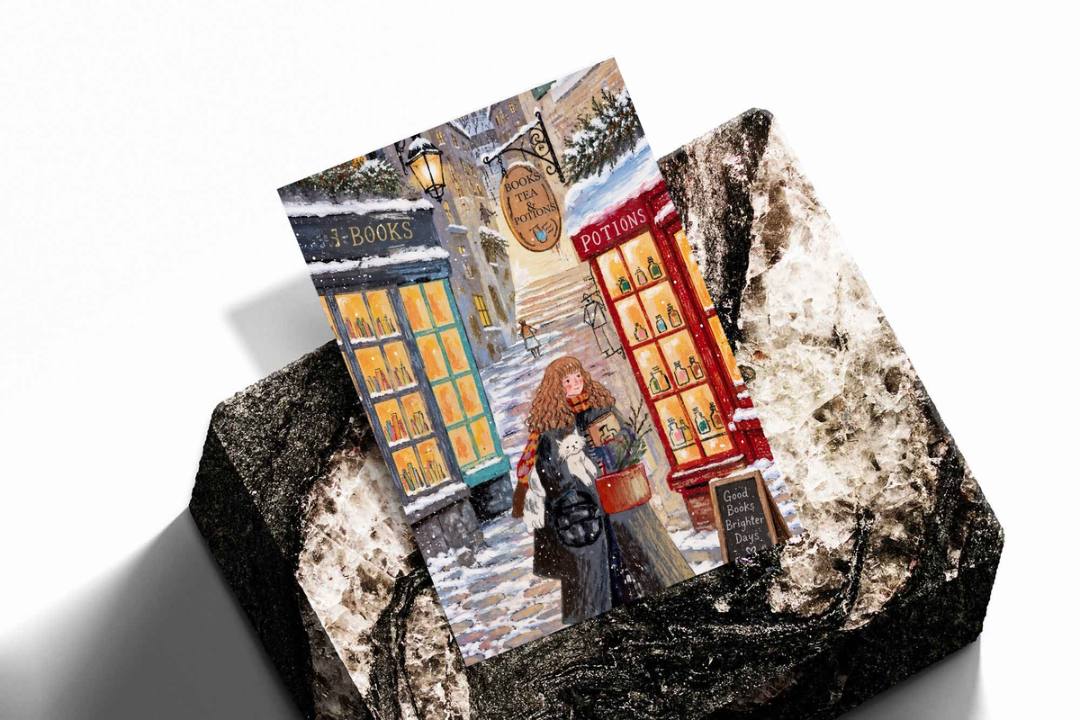 Overlapping prints of snowy bookshop scene with red-haired girl and white cat