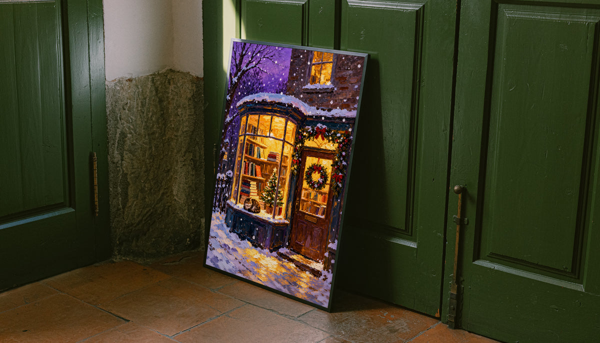 Christmas bookshop print with a cat in the window, glowing lights and snowy ground