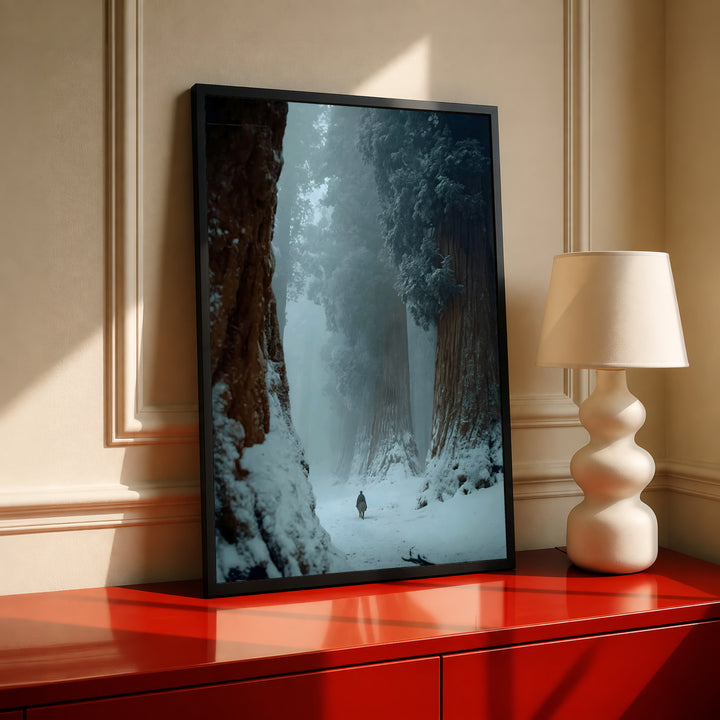 Black-framed winter forest print with snowy path between tall dark trees