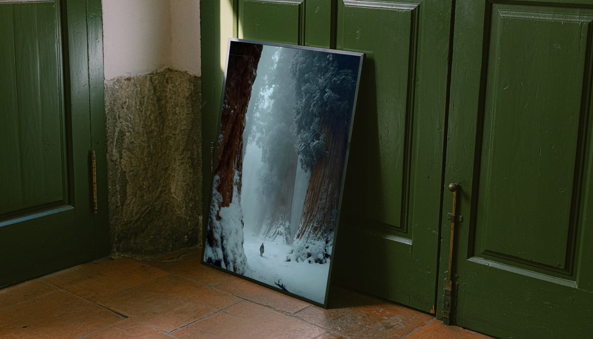 Winter forest print with dark frame, featuring snowy path and distant walker