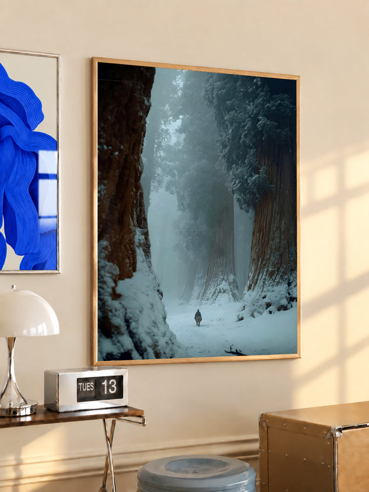 Wood-framed winter forest print with snowy path and distant figure under fog