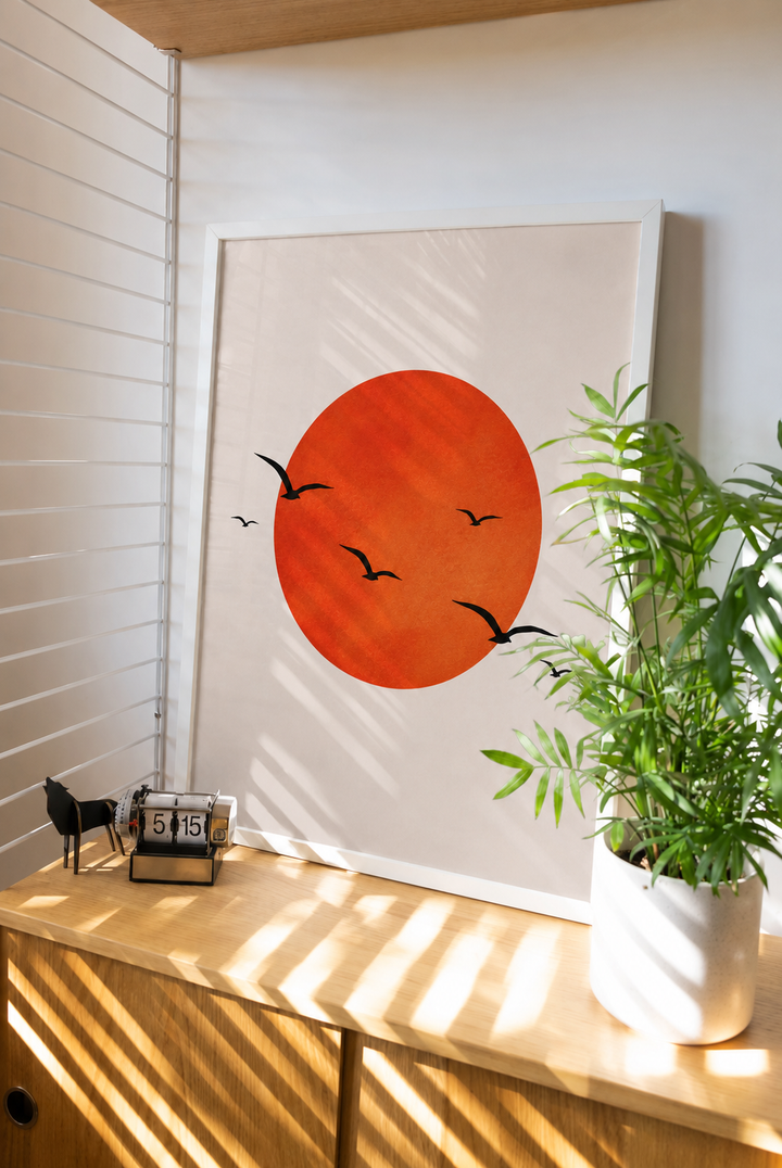 Sun wall art poster with orange circle and black flying birds on a light background