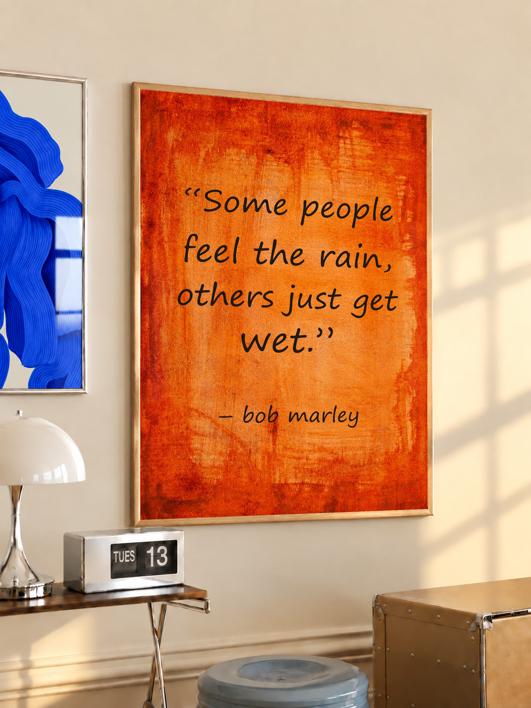 Framed quote poster with orange textured print and “bob marley” signature line