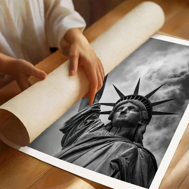 Statue of Liberty Art Print showing the torch and crown against an atmospheric cloudy backdrop