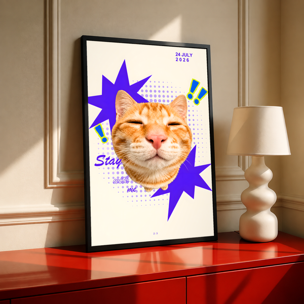 Smiling orange tabby cat with purple stars and Stay With Me lettering; black framed print on a red cabinet