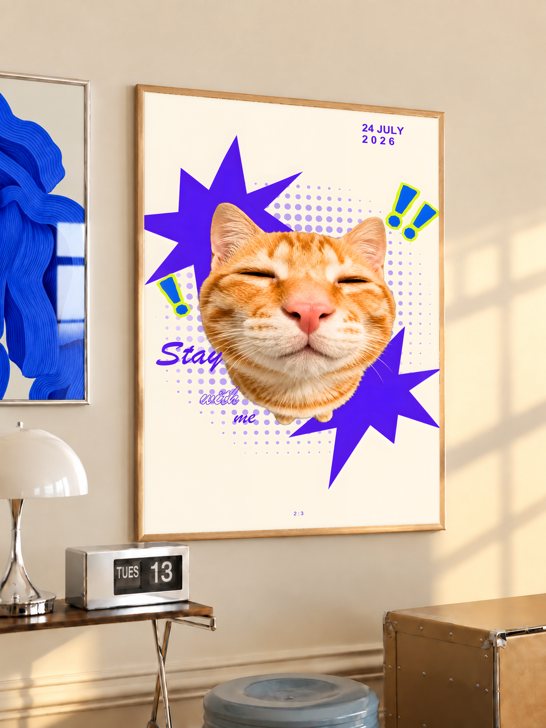 Smiling orange tabby cat with purple stars and Stay With Me lettering; oak framed print in a desk setting