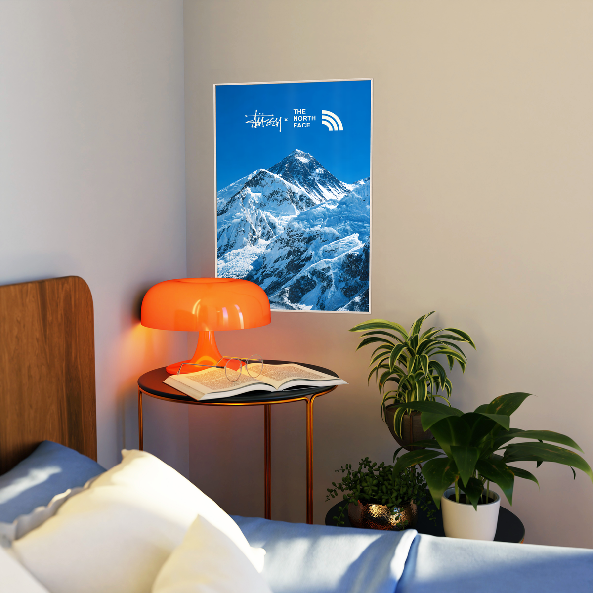 Blue snowy mountain landscape with Stussy and The North Face marks; artwork styled in a living room