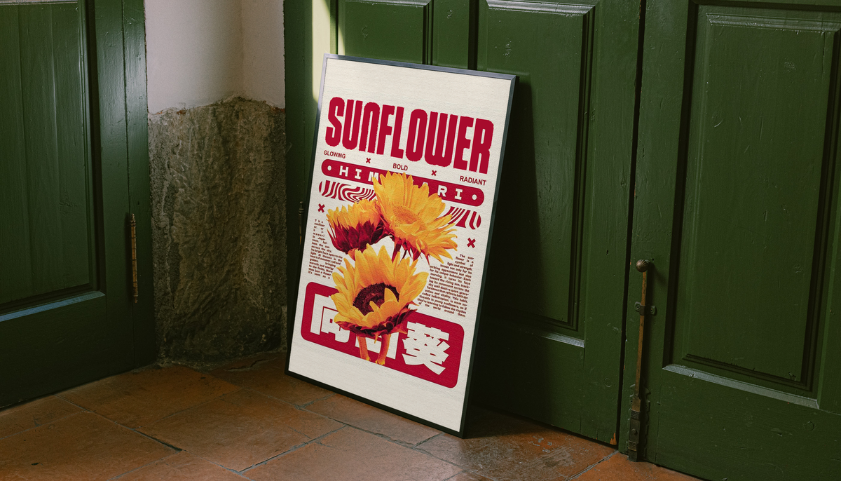 Sunflower poster in a dark frame against green doors, with yellow blooms and red lettering.