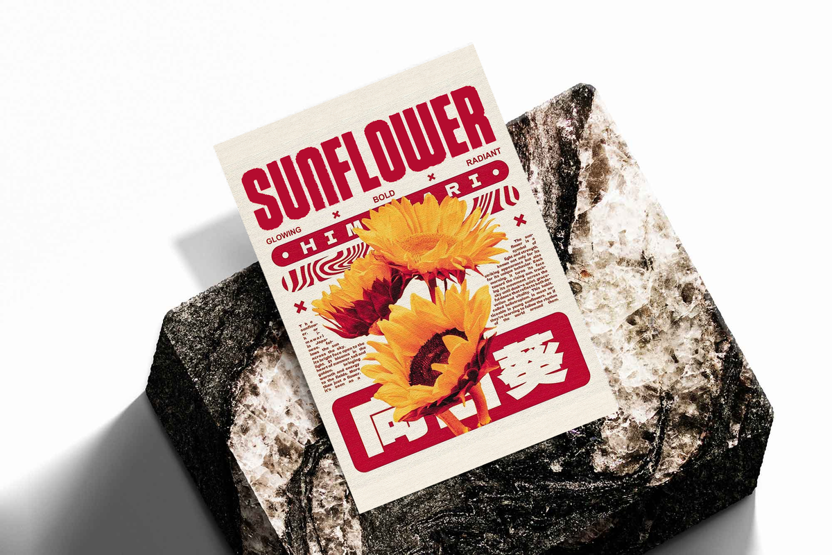 Sunflower poster print with yellow blooms and red text resting on a textured dark rock.