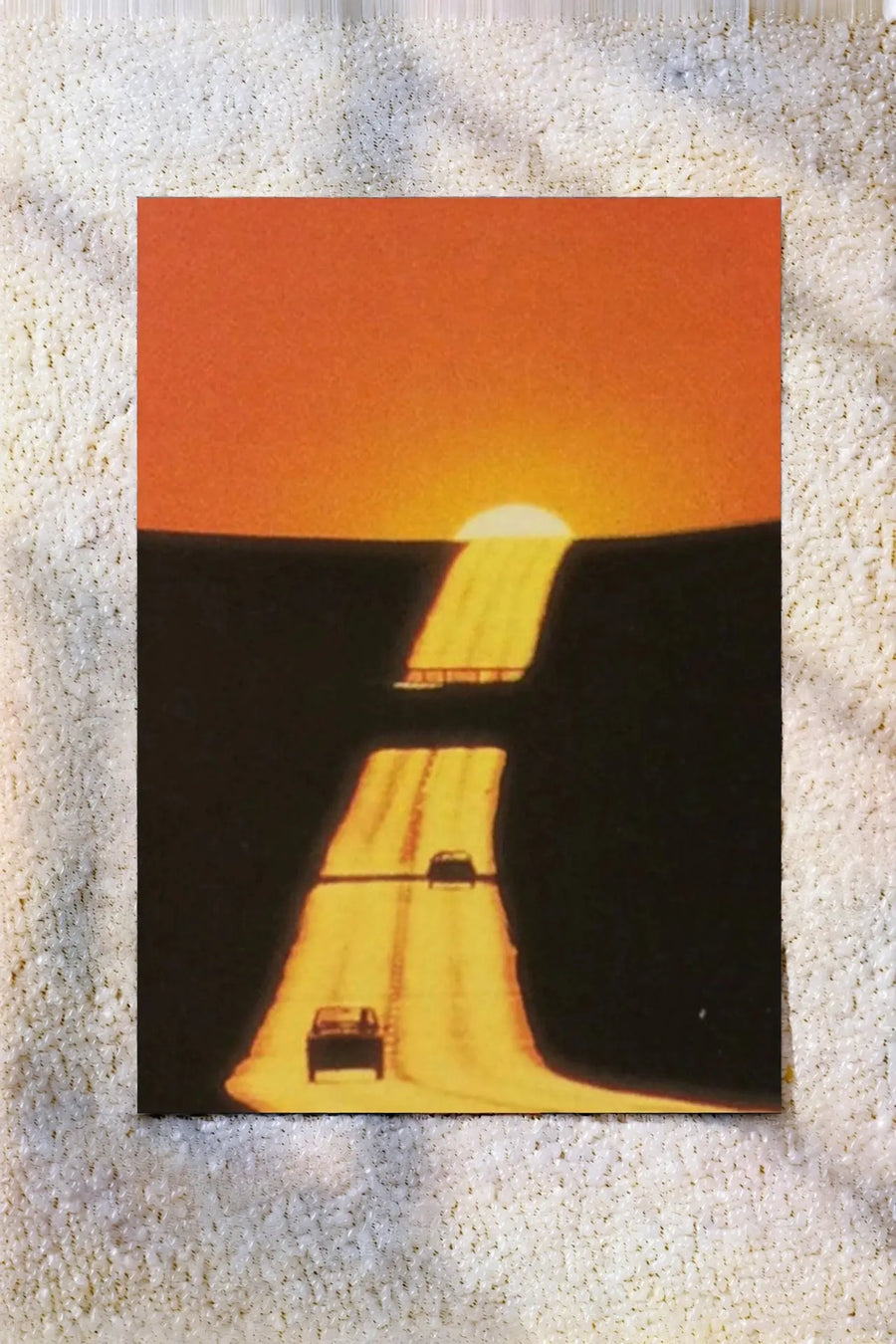 Abstract sunset artwork print with orange sky, dark road, and glowing streetlights