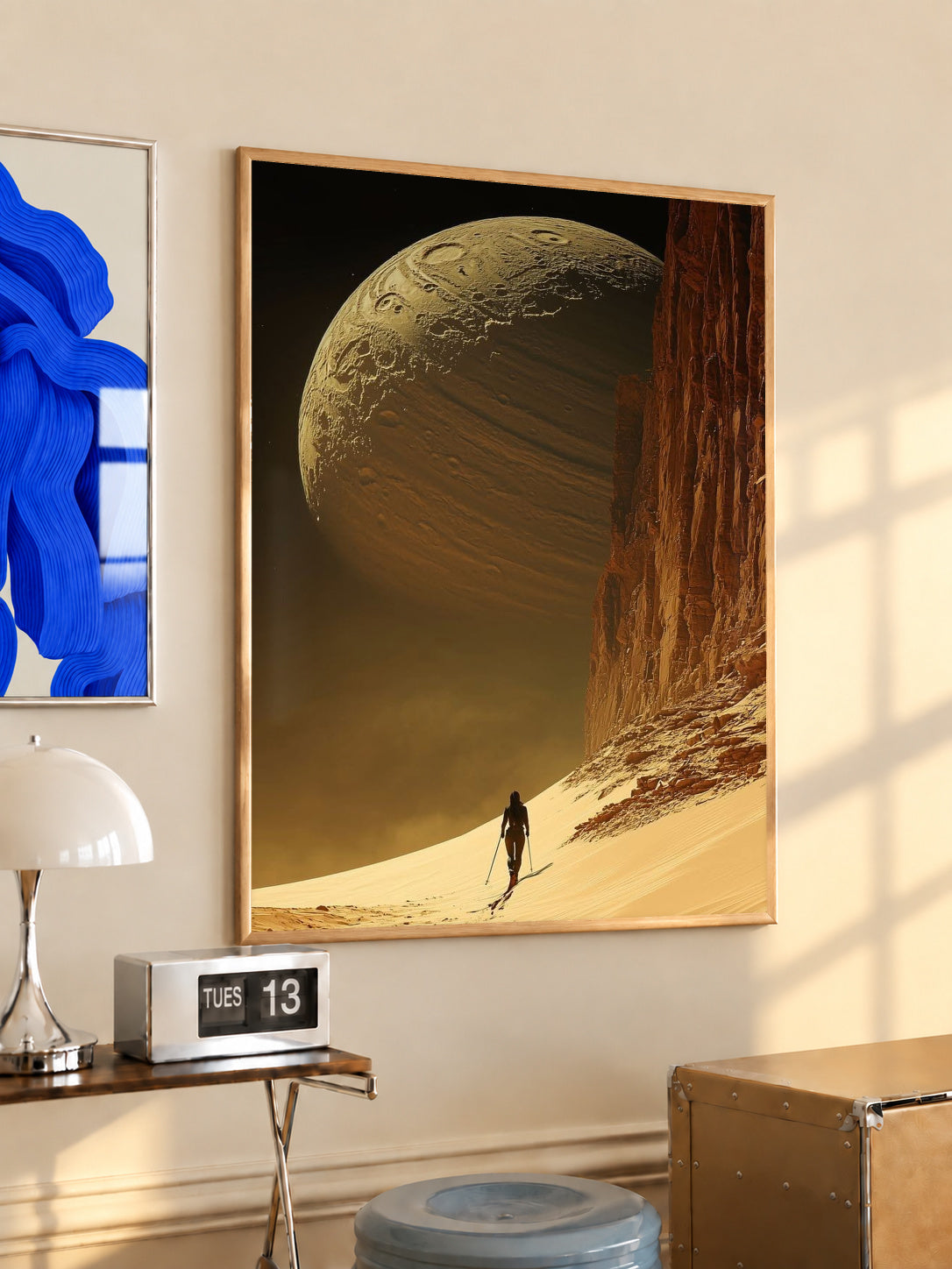 Light wood-framed desert planet poster with golden cliff, large planet, lone traveler silhouette.