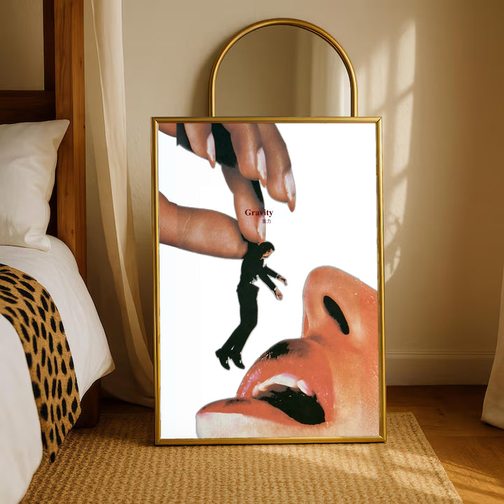 Gold-framed surreal mouth collage poster with giant hand, miniature figure, and open mouth