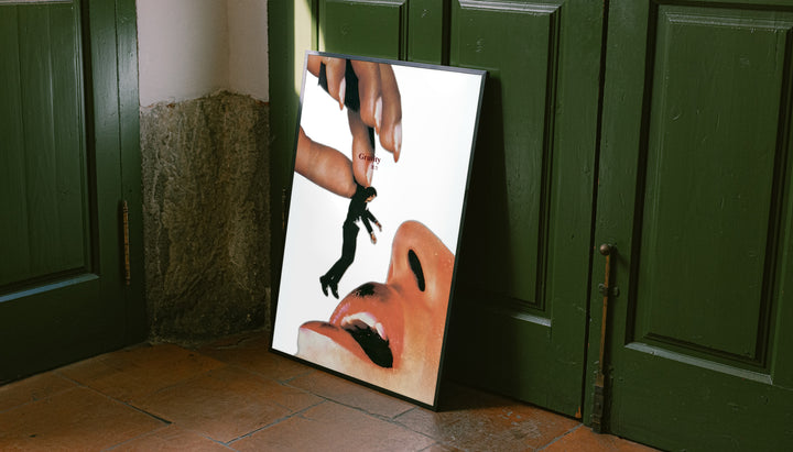 Tilted framed surreal collage poster with giant hand, miniature man, and open mouth graphic
