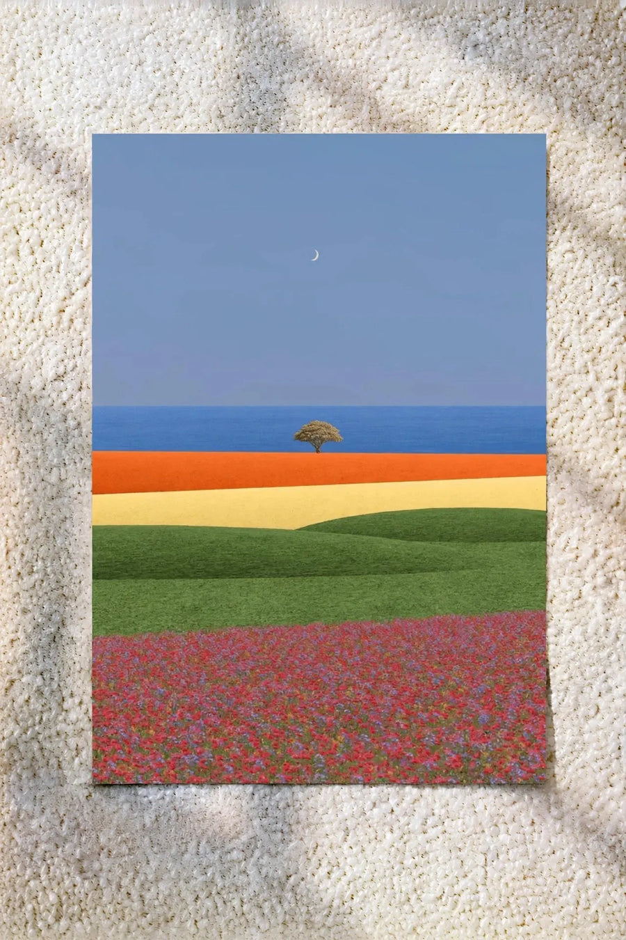 Landscape wall art poster with blue sky, distant tree, and layered green and red fields