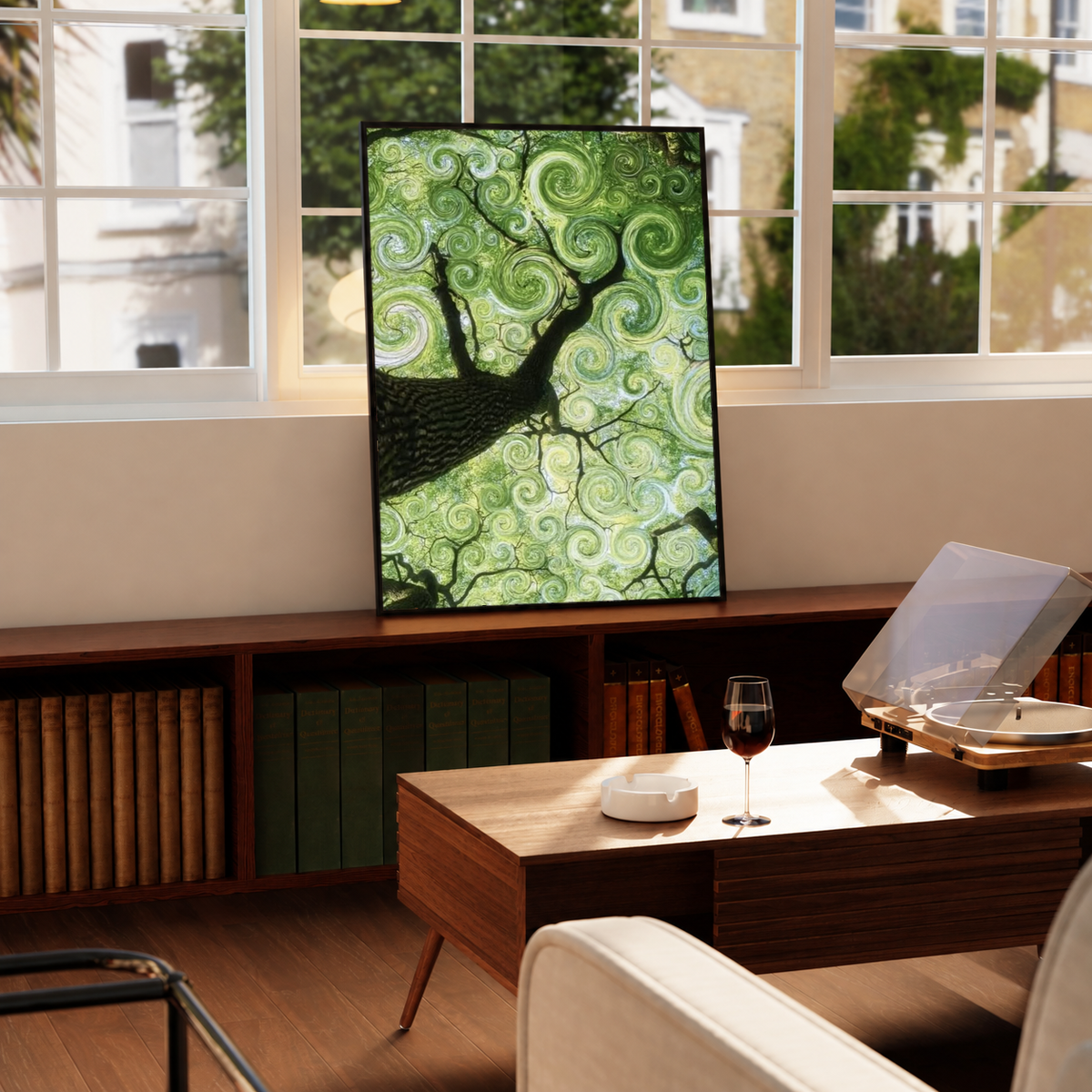 Swirling green tree canopy in a black frame on a windowsill above a green radiator, with a turntable nearby