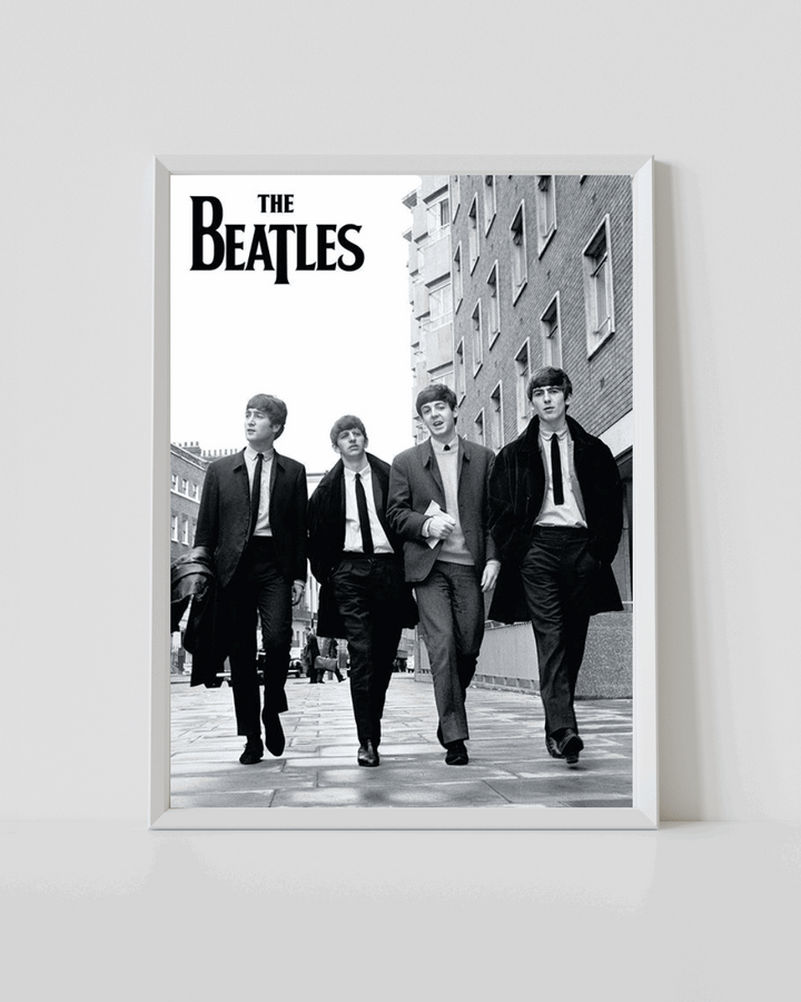 The Beatles black-and-white music poster featuring band walking, in a white frame