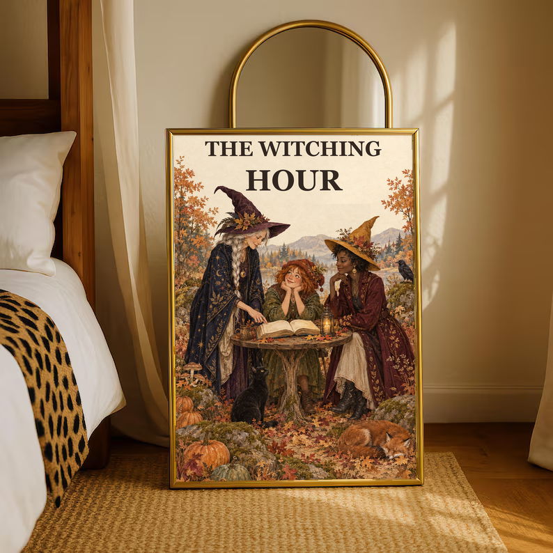 Gold-trim framed Witching Hour art print with three witches reading an open book
