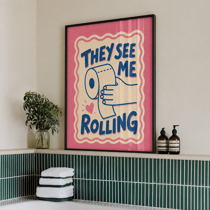 Framed wall art print with pink background, megaphone illustration, and “THEY SEE ME ROLLING”