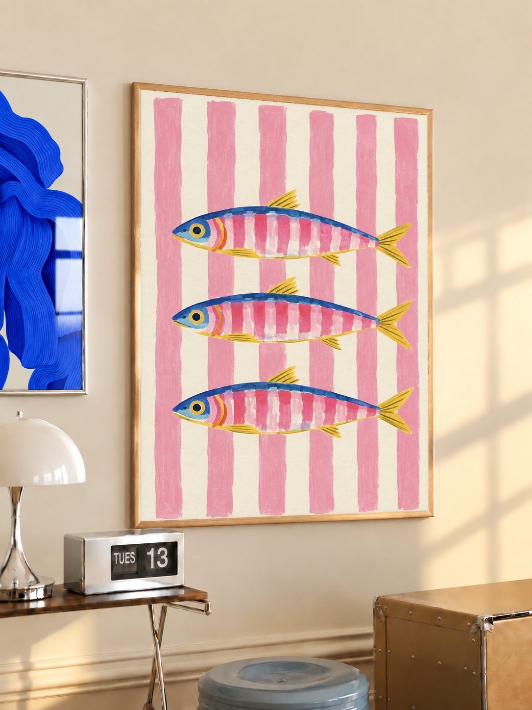 Framed vertical art print with three fish and pink striped background