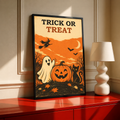 Black-framed Halloween poster with “Trick or Treat,” ghost, jack-o’-lantern pumpkin, cat