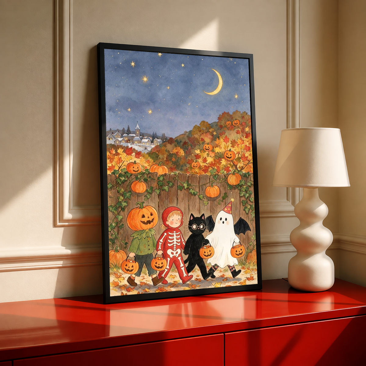 Framed Halloween art print showing costumed kids, jack-o'-lanterns, cat, and ghost