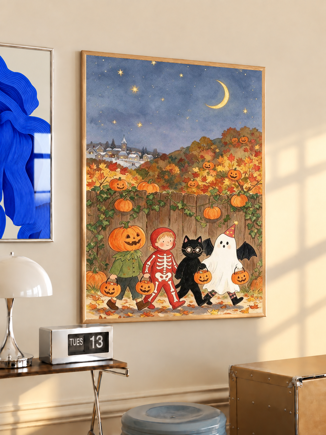 Framed Halloween art print with costumed children, pumpkins, and a night sky with moon