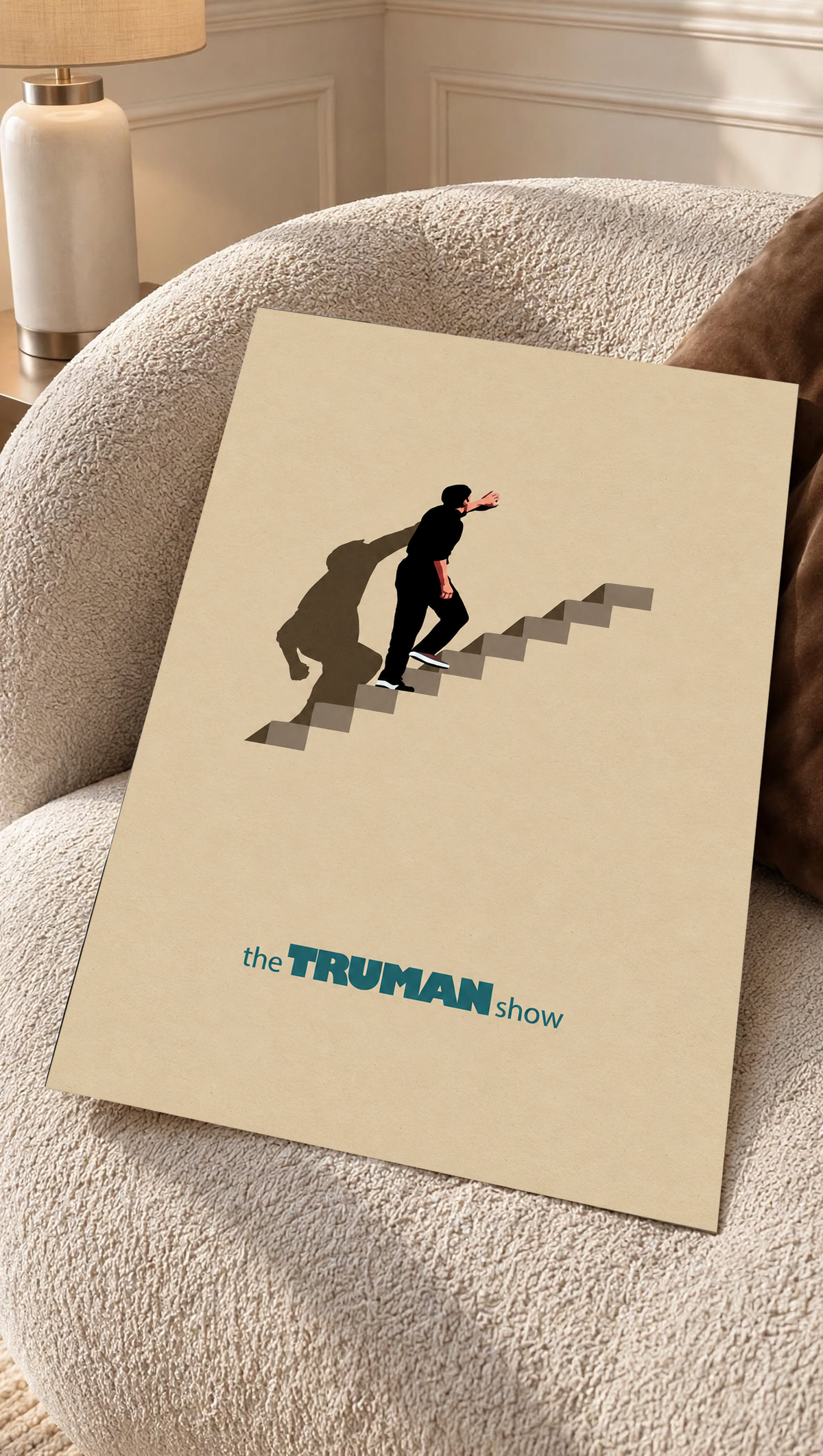 Unframed staircase poster on beige sofa cushion, lone figure on steps