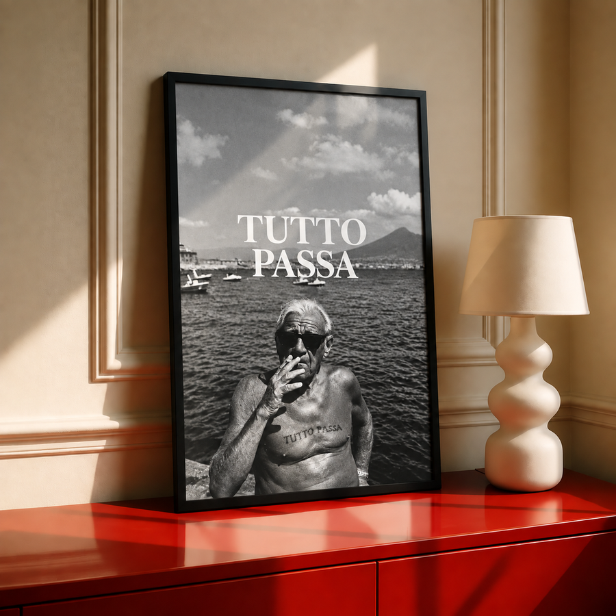 Black framed black-and-white wall art poster with “TUTTO PASSA” over seaside photo