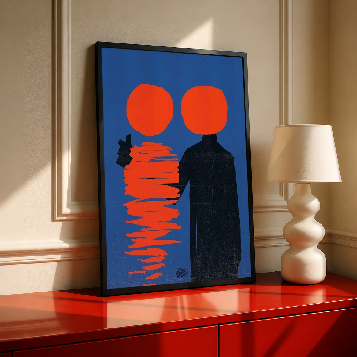 Black-framed abstract poster with two orange circles, a black figure, and red stacked lines