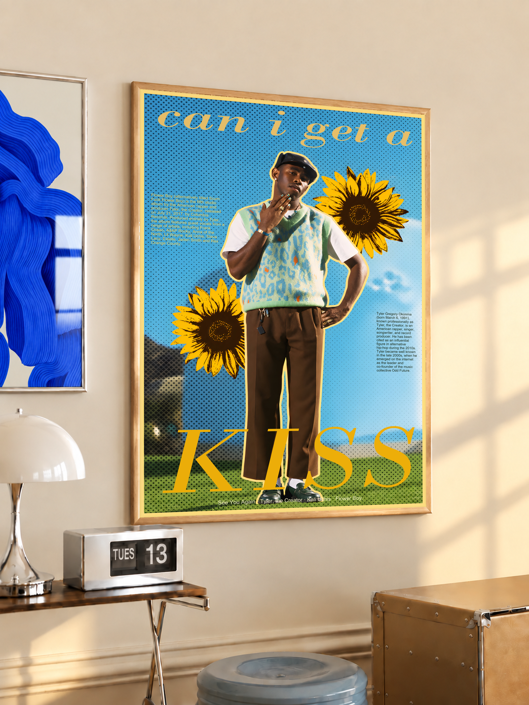 Tyler the Creator portrait collage with sunflowers and Can I Get a Kiss lettering; oak framed print in a desk setting