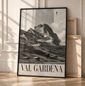 Black-framed grayscale mountain landscape poster with valley houses