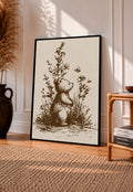 Framed vintage bear and bee art print with wildflower stems, sepia ink, black border.