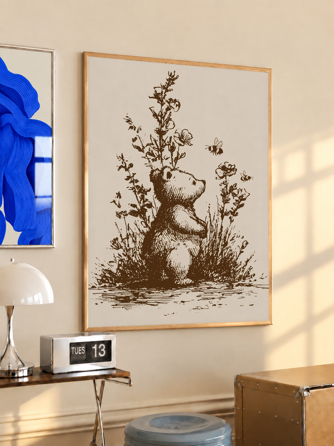 Framed bear and bees art print with wildflower stems, sepia illustration, light wood frame.